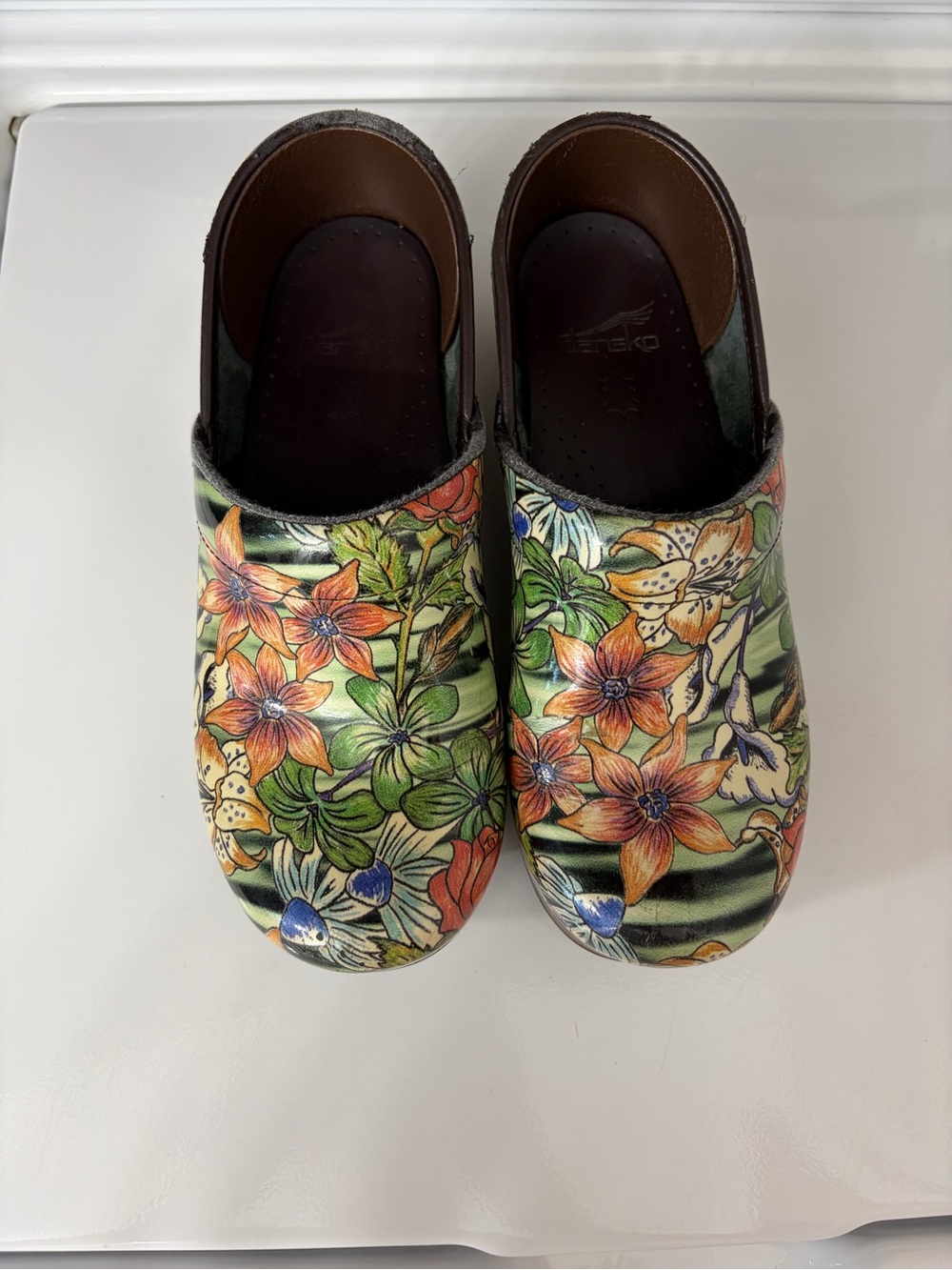 Dansko Floral Slip-On Clogs in Orange, Green, Blue